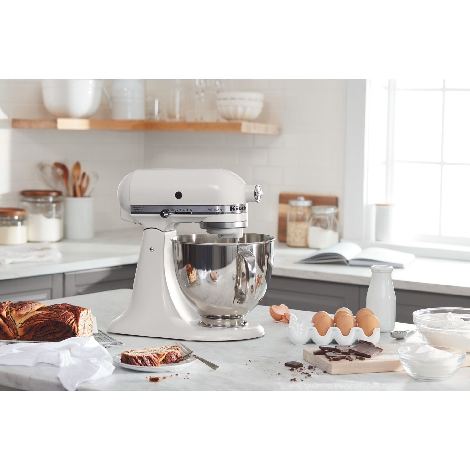 Milkshake tilt-head stand mixer with stainless steel bowl and beater, on counter