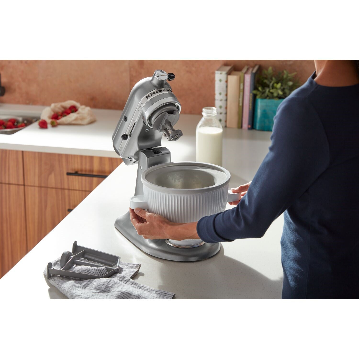 Contour silver tilt-head stand mixer holding a white mixing bowl with dough