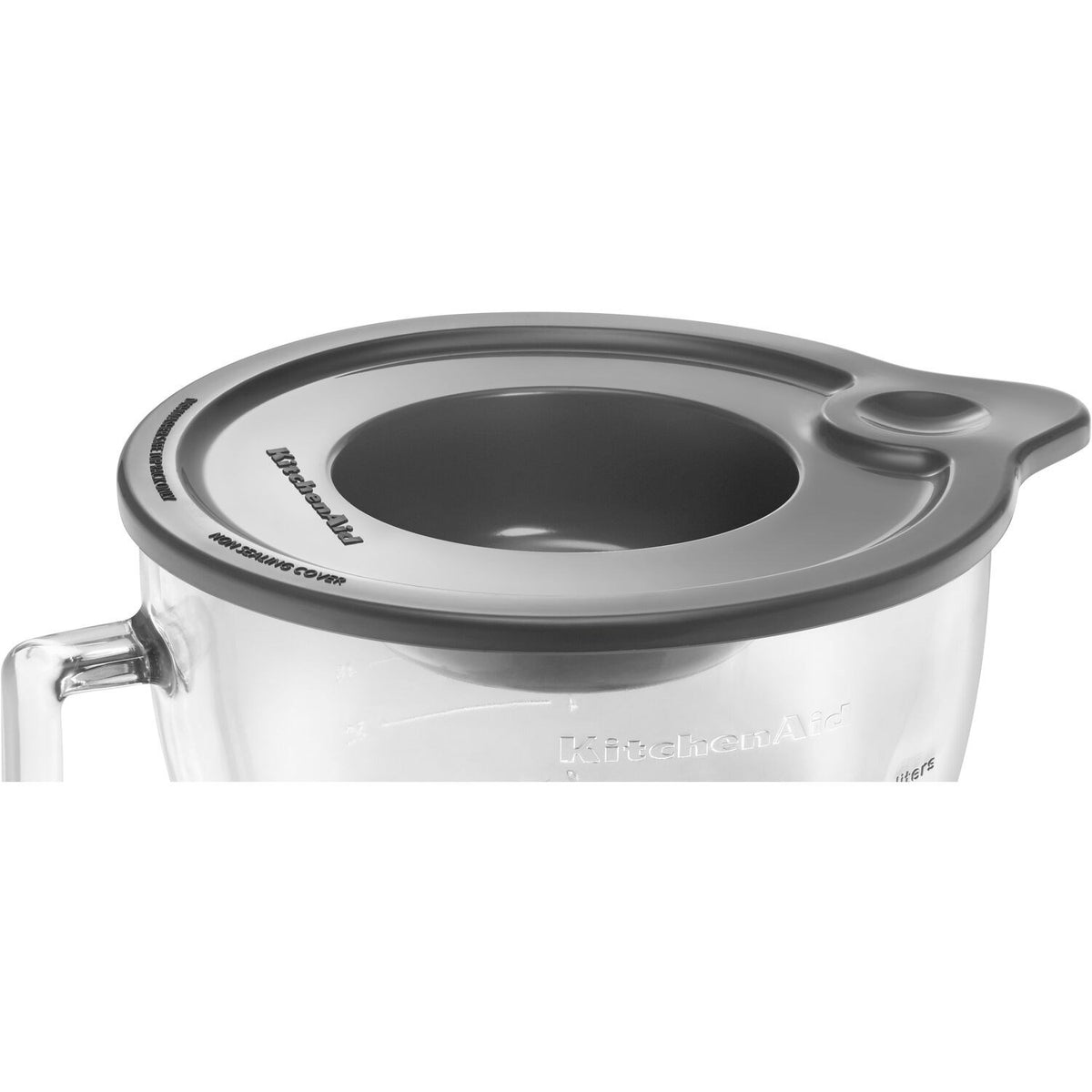 Gray splash shield lid with central pour opening for clear glass mixing bowl