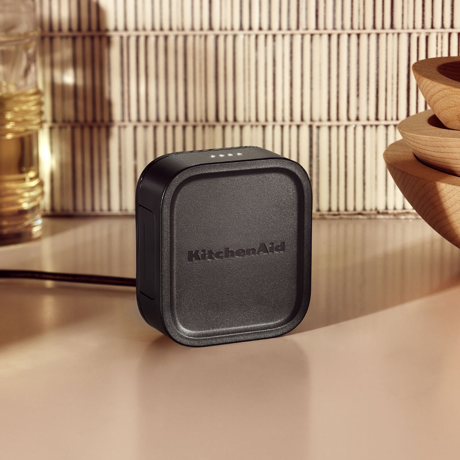 Black KitchenAid 12V battery pack with textured top and side release button
