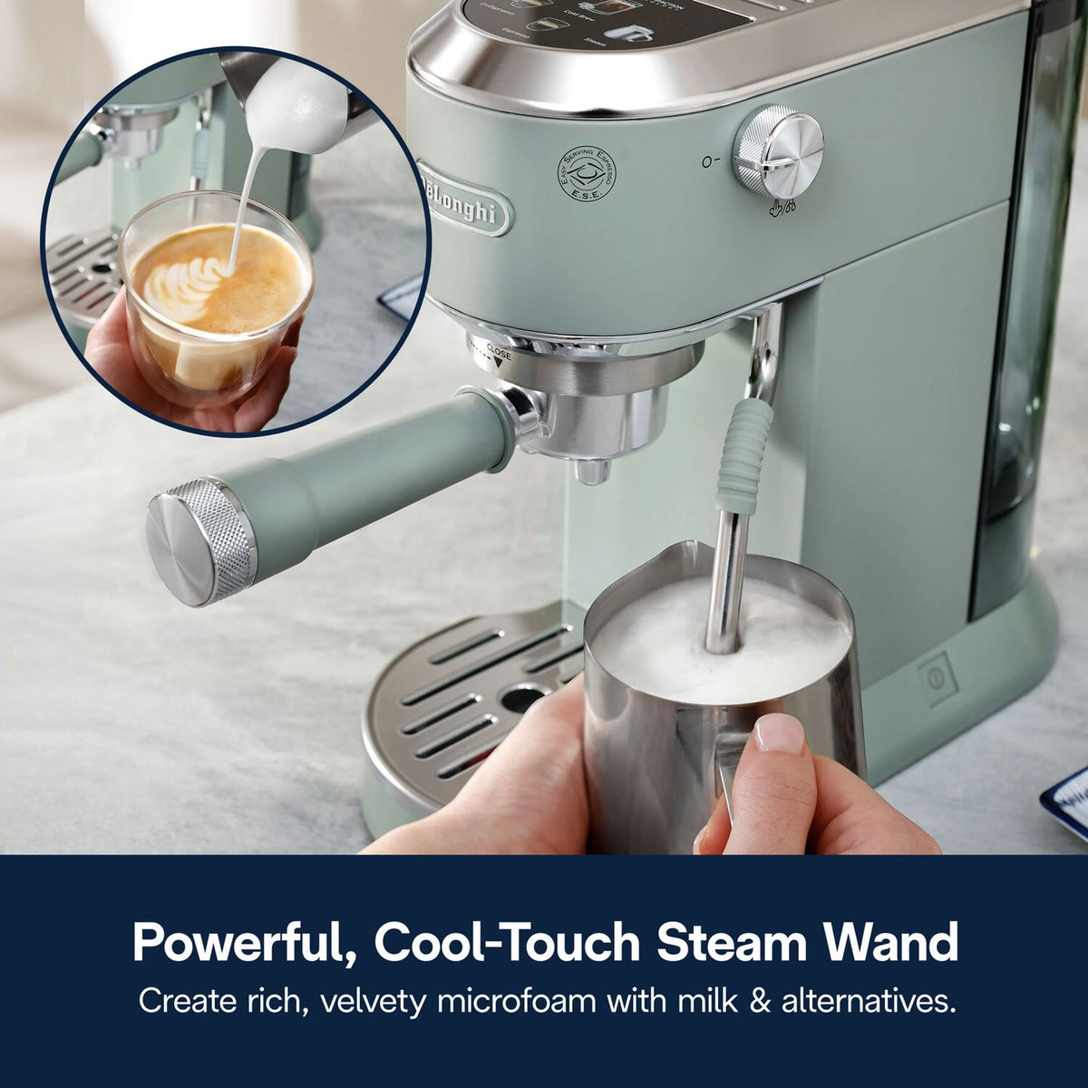 Green De'Longhi frothing steam wand creating microfoam in stainless milk cup