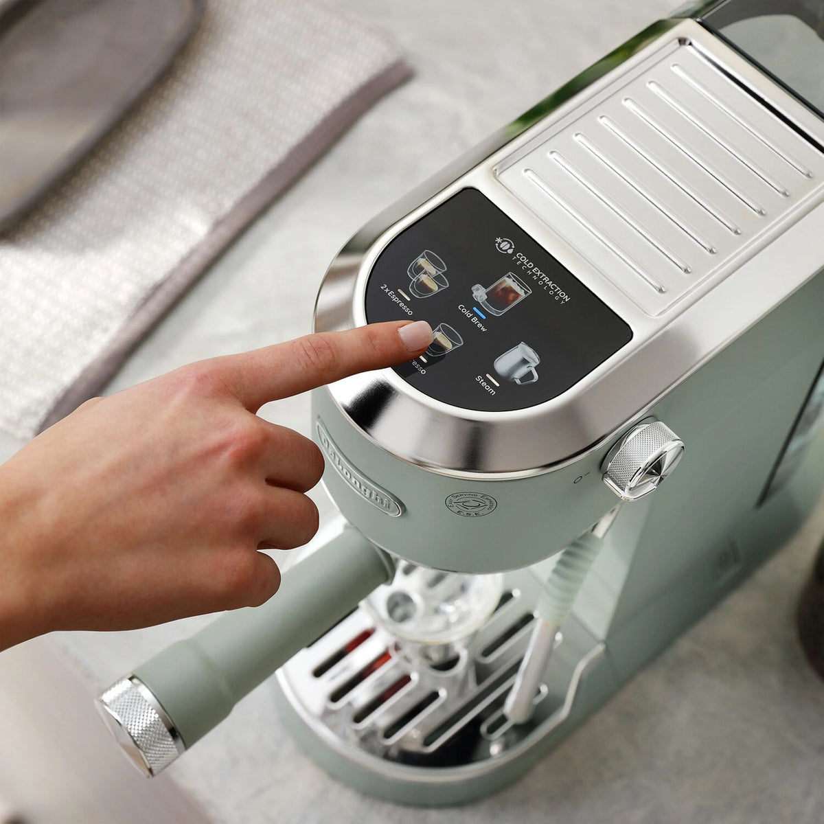 Green De'Longhi espresso machine control panel with touch display and steam knob