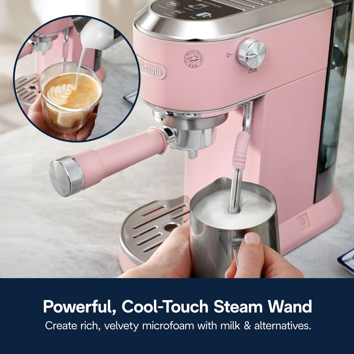 Pink frothing wand steaming milk into a cup of espresso drinks