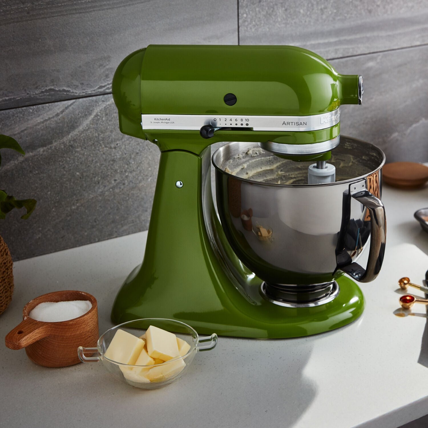 Matcha green tilt-head stand mixer with stainless bowl and dough hook attachment