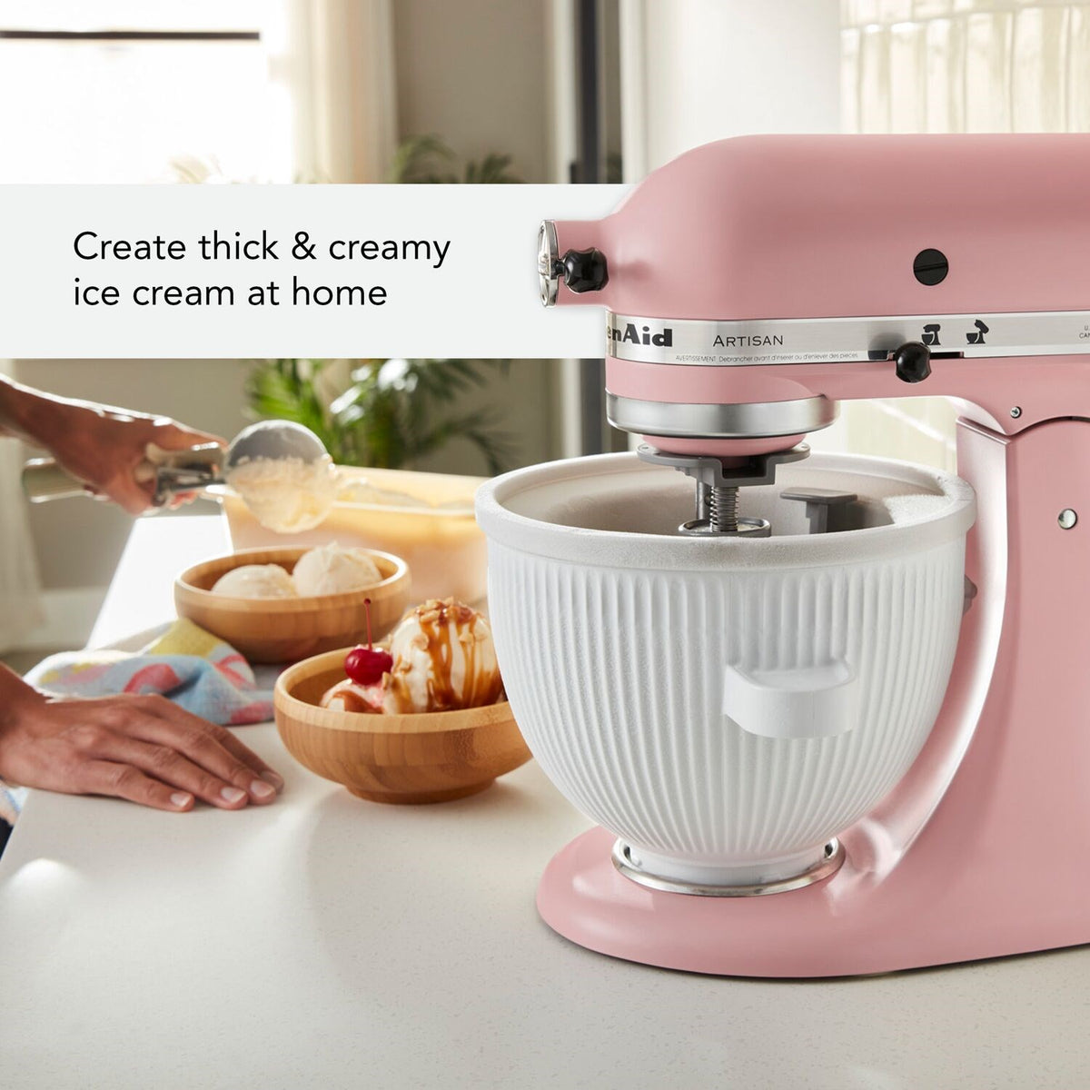 Pink Artisan stand mixer with white ice cream maker attachment bowl