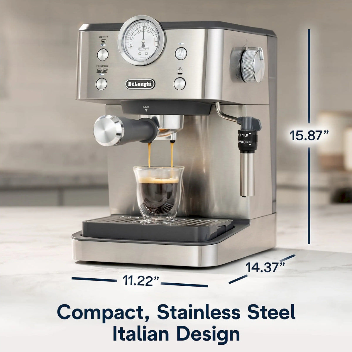 Stainless espresso machine dispensing espresso, with cup and drip tray in view