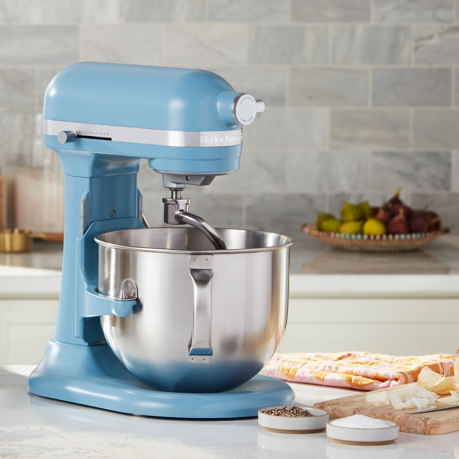 KitchenAid stand mixer in velvet blue with stainless bowl and mixing head
