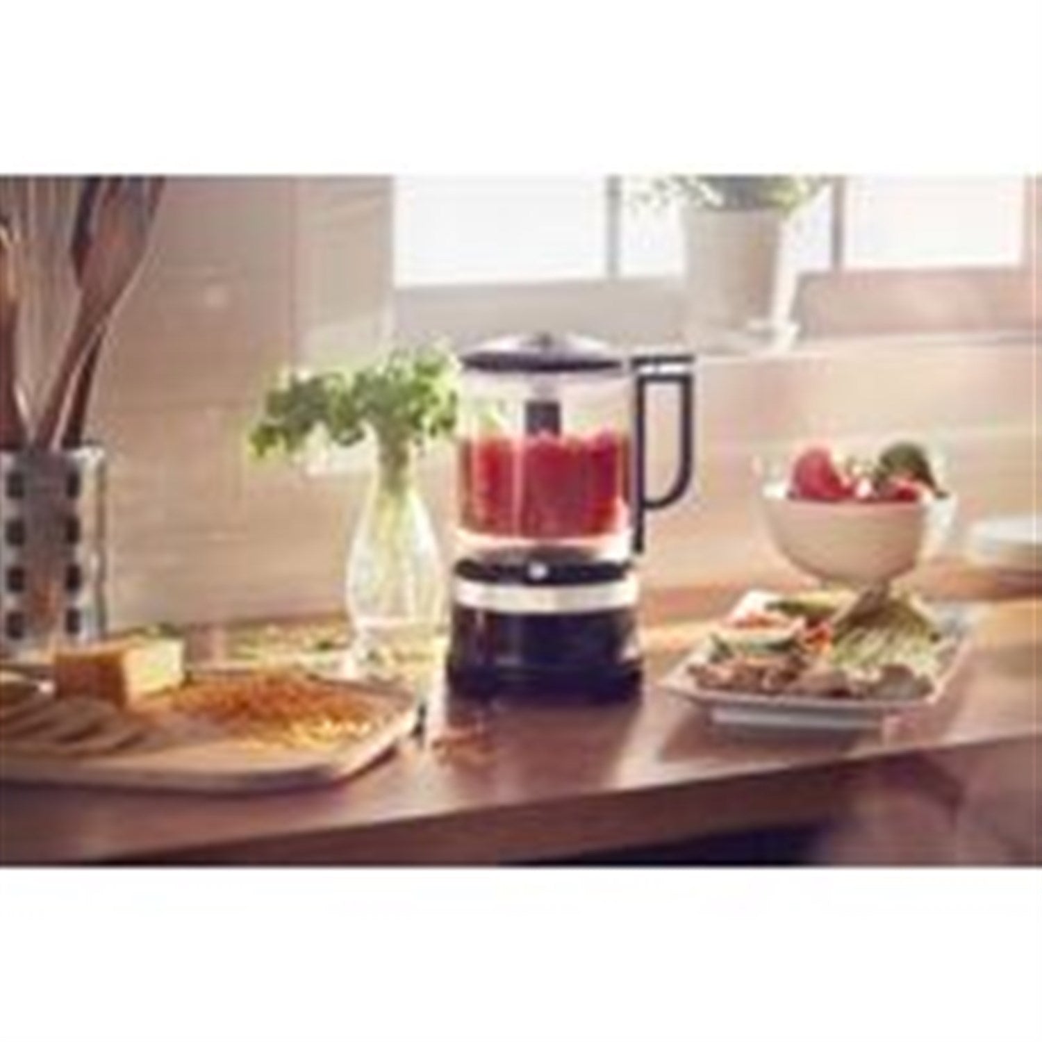 Onyx black food chopper with clear bowl on countertop