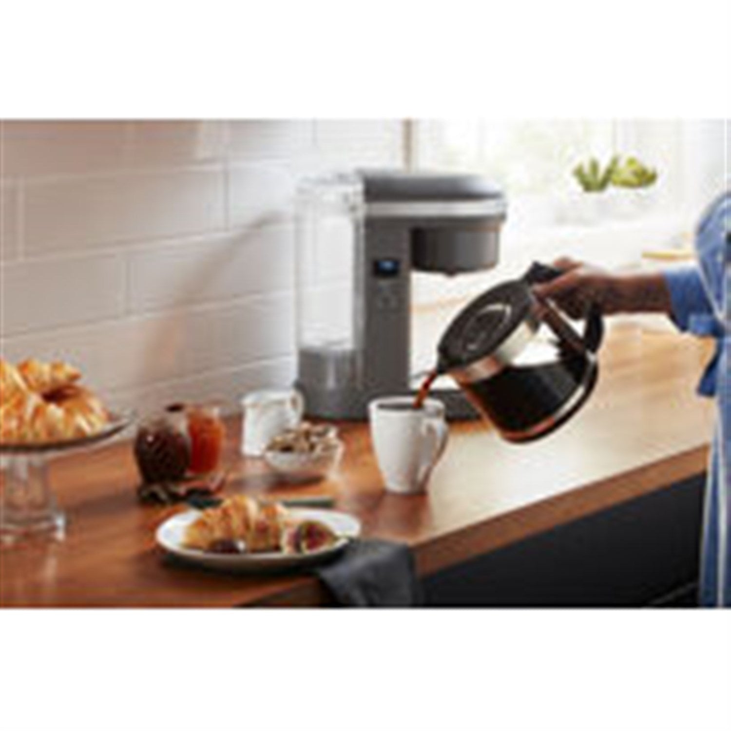 Charcoal grey KitchenAid 12-cup drip coffee brewer on kitchen counter