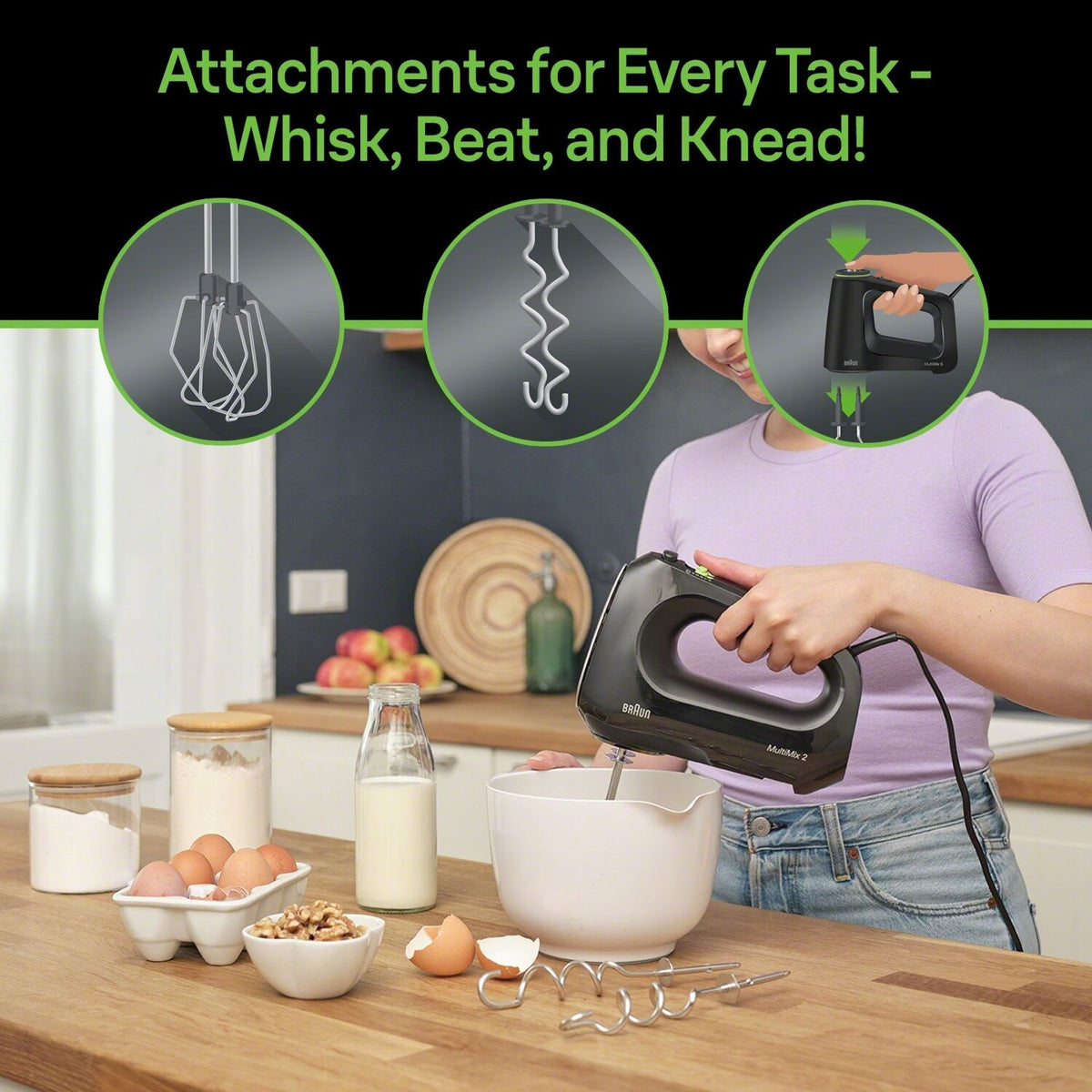 Black hand mixer with whisk, beaters, and dough hooks attachments
