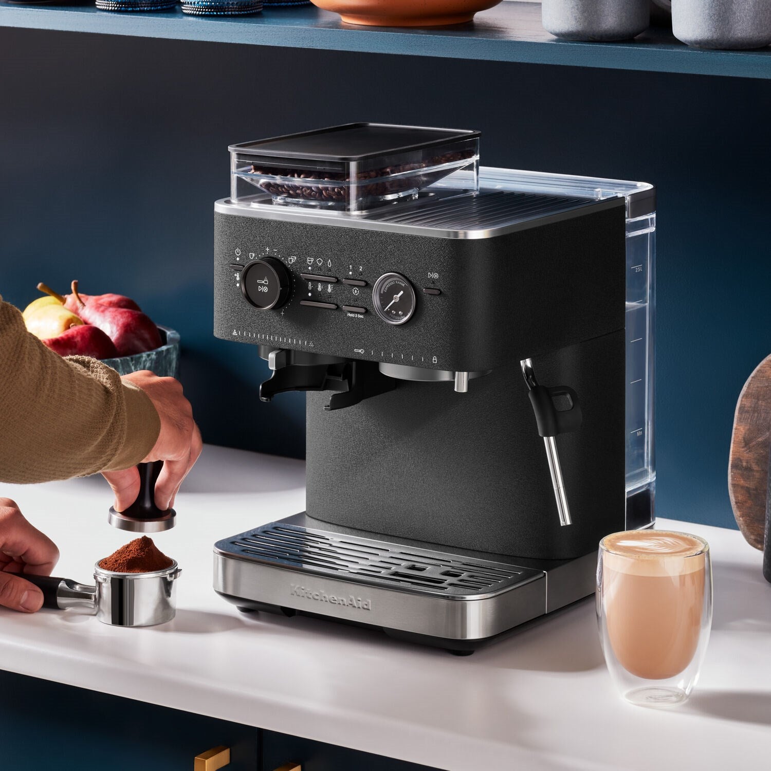 Black espresso machine with open grinder hopper, portafilter, and stainless drip tray