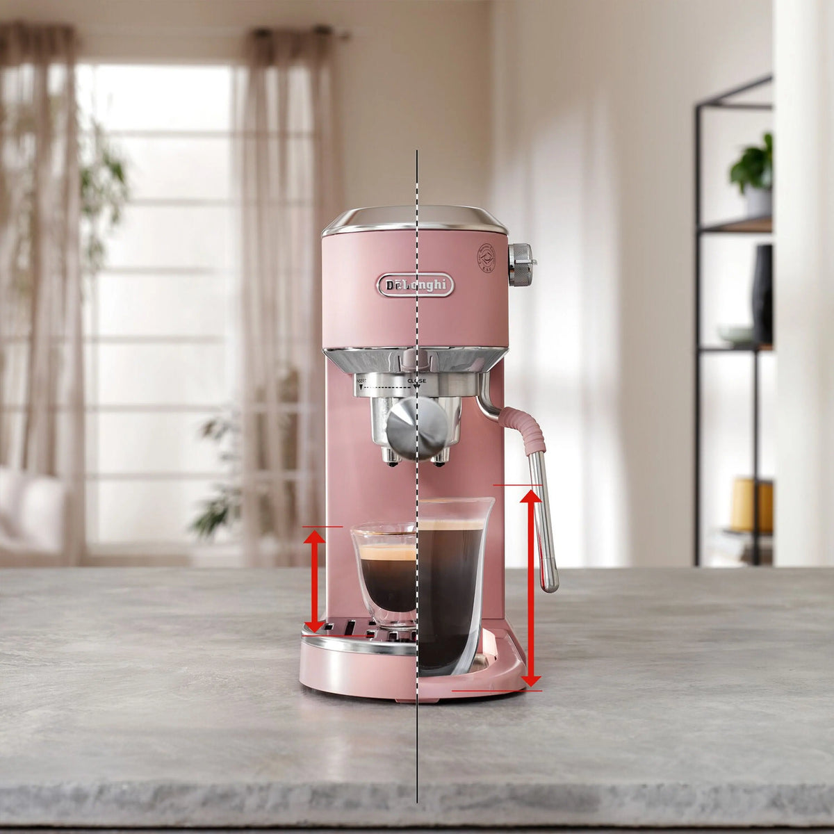 Pink espresso machine dispensing coffee into two cups with steam wand attached