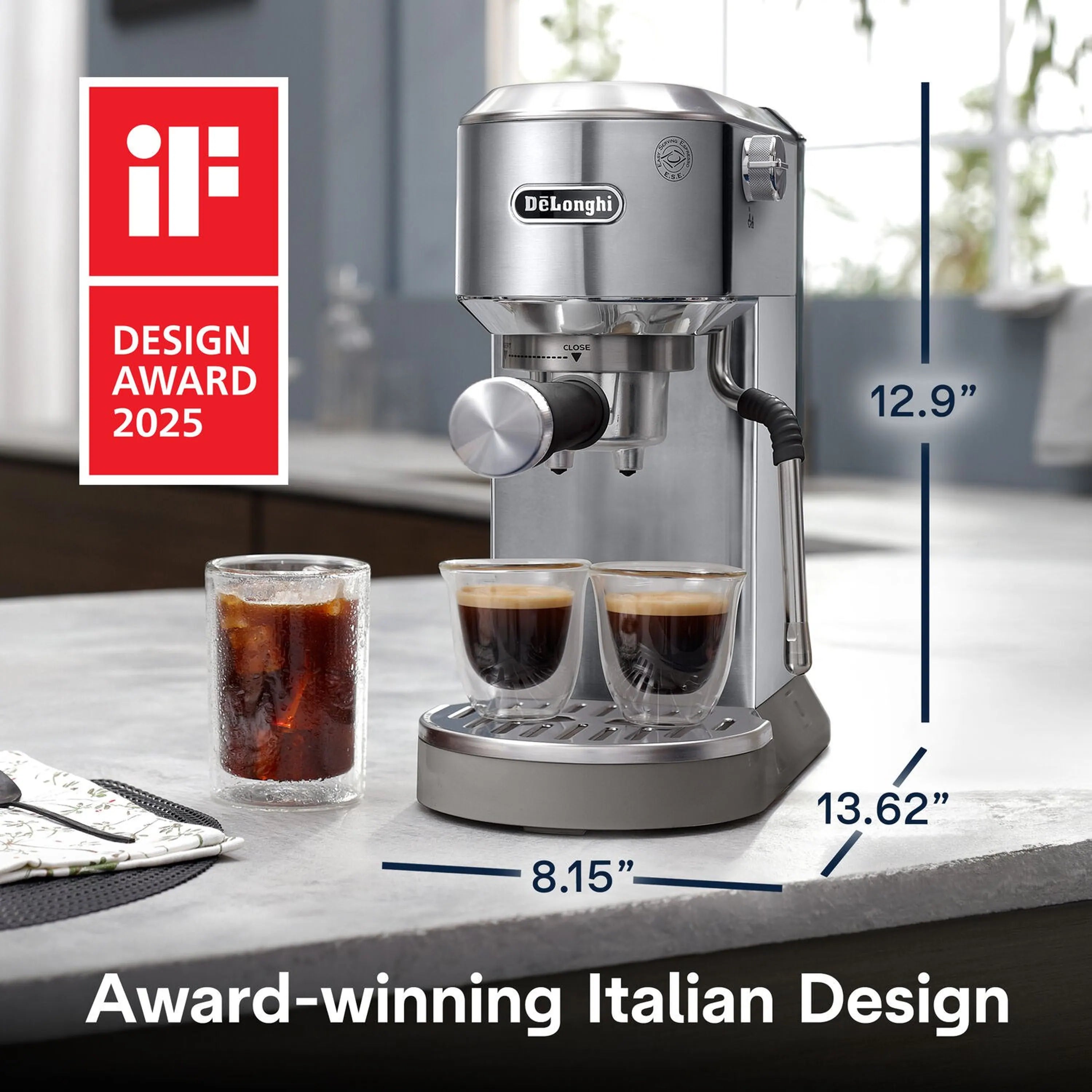 Stainless espresso machine on countertop with three shot cups and a measuring scale