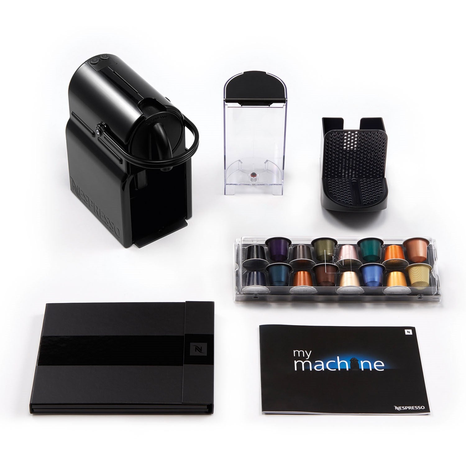 Black Nespresso espresso machine with capsule variety and accessory trays