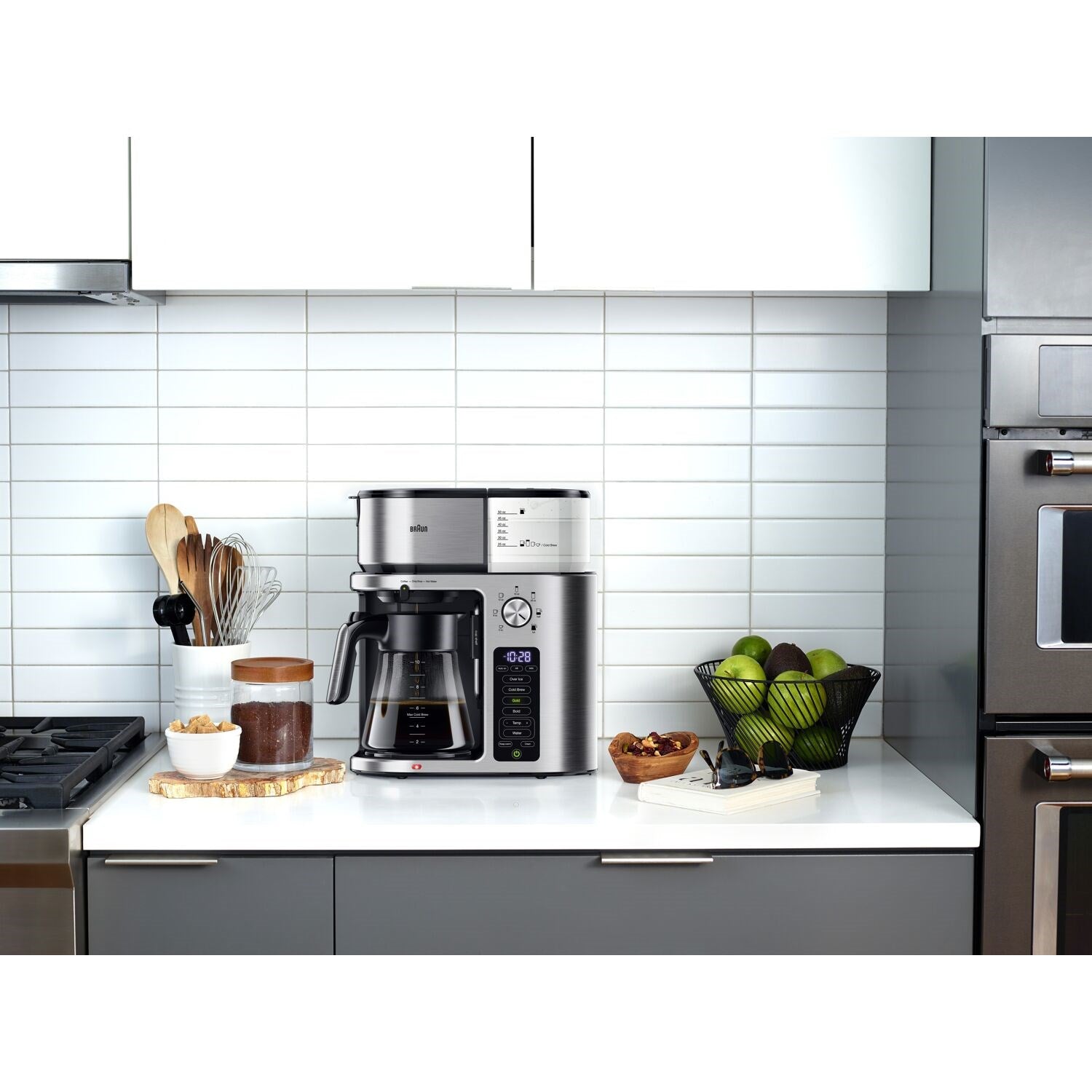 Braun coffee maker on kitchen countertop with carafe and control panel