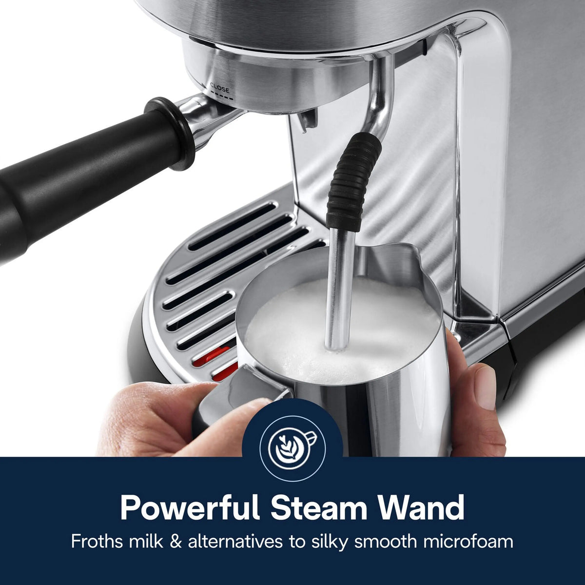Stainless steel steam wand frothing milk into a cup for espresso-style drinks