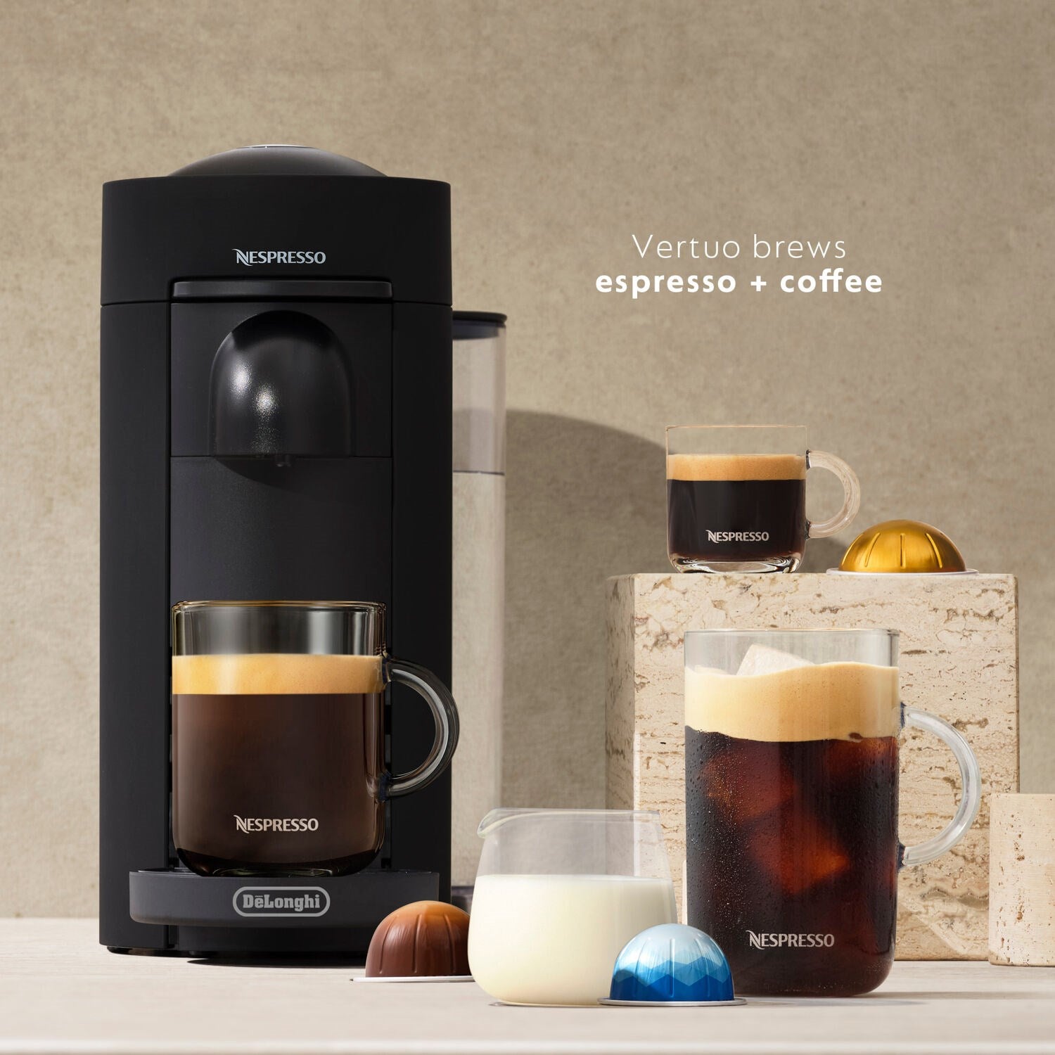 Black De'Longhi Nespresso Vertuo Plus single-serve coffee and espresso machine with cup