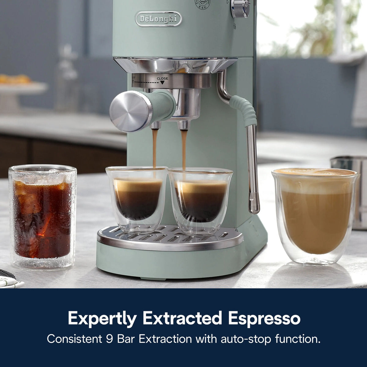 De'Longhi Dedica Duo espresso machine, mint green, dual cups under spouts with frothing wand