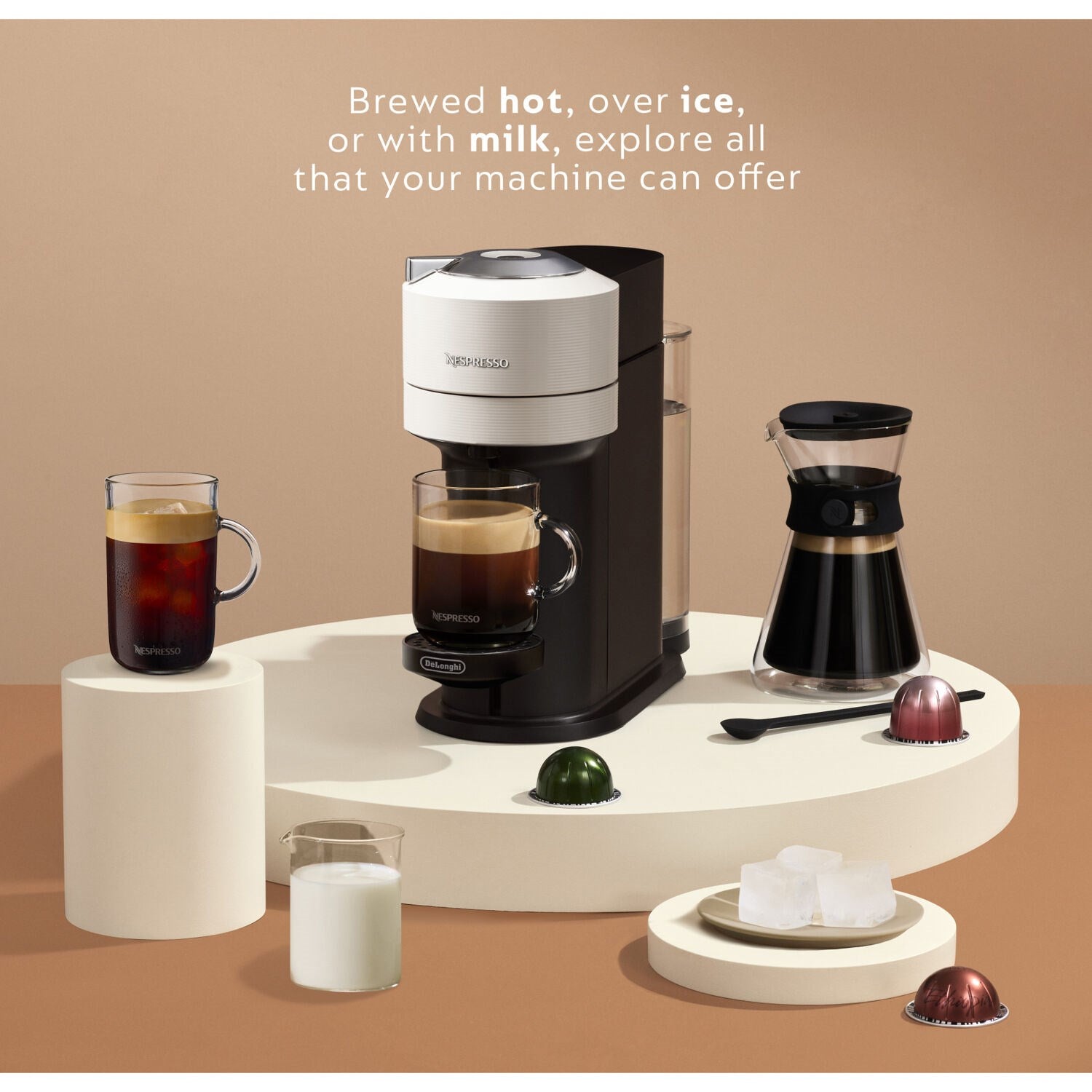 Vertuo Next coffee machine with Aeroccino milk frother, cups, and colorful capsules