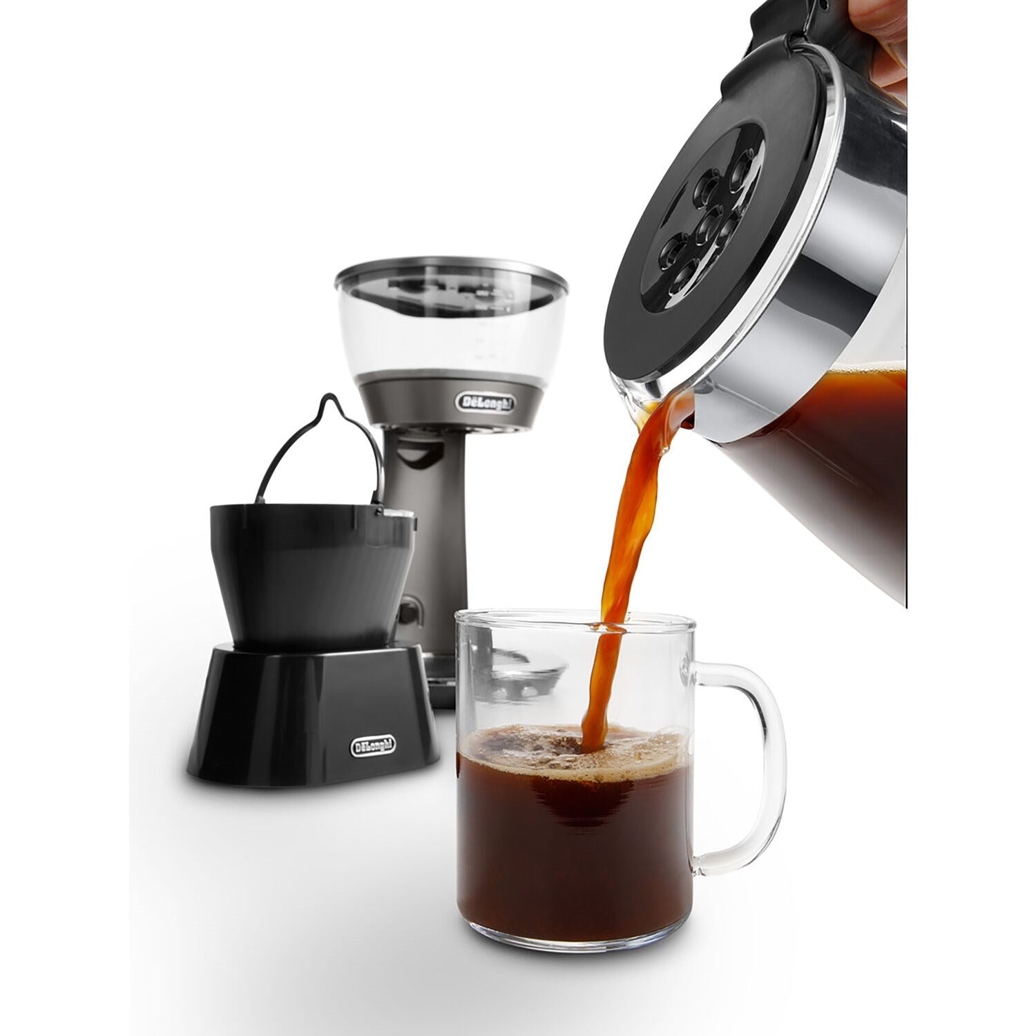 3-in-1 coffee brewer pouring hot coffee into clear glass mug