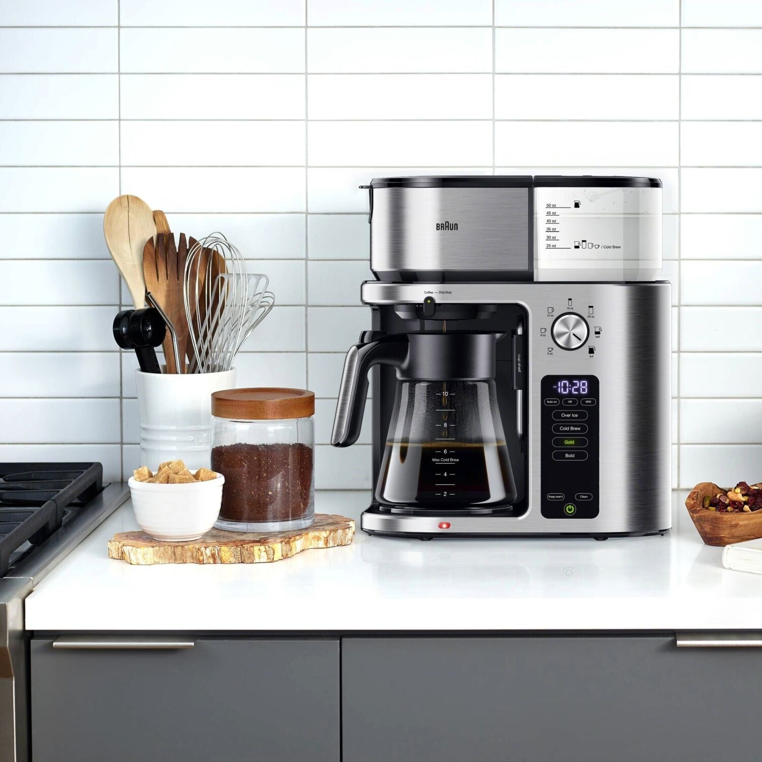 Stainless steel 10-cup coffee maker with glass carafe on countertop