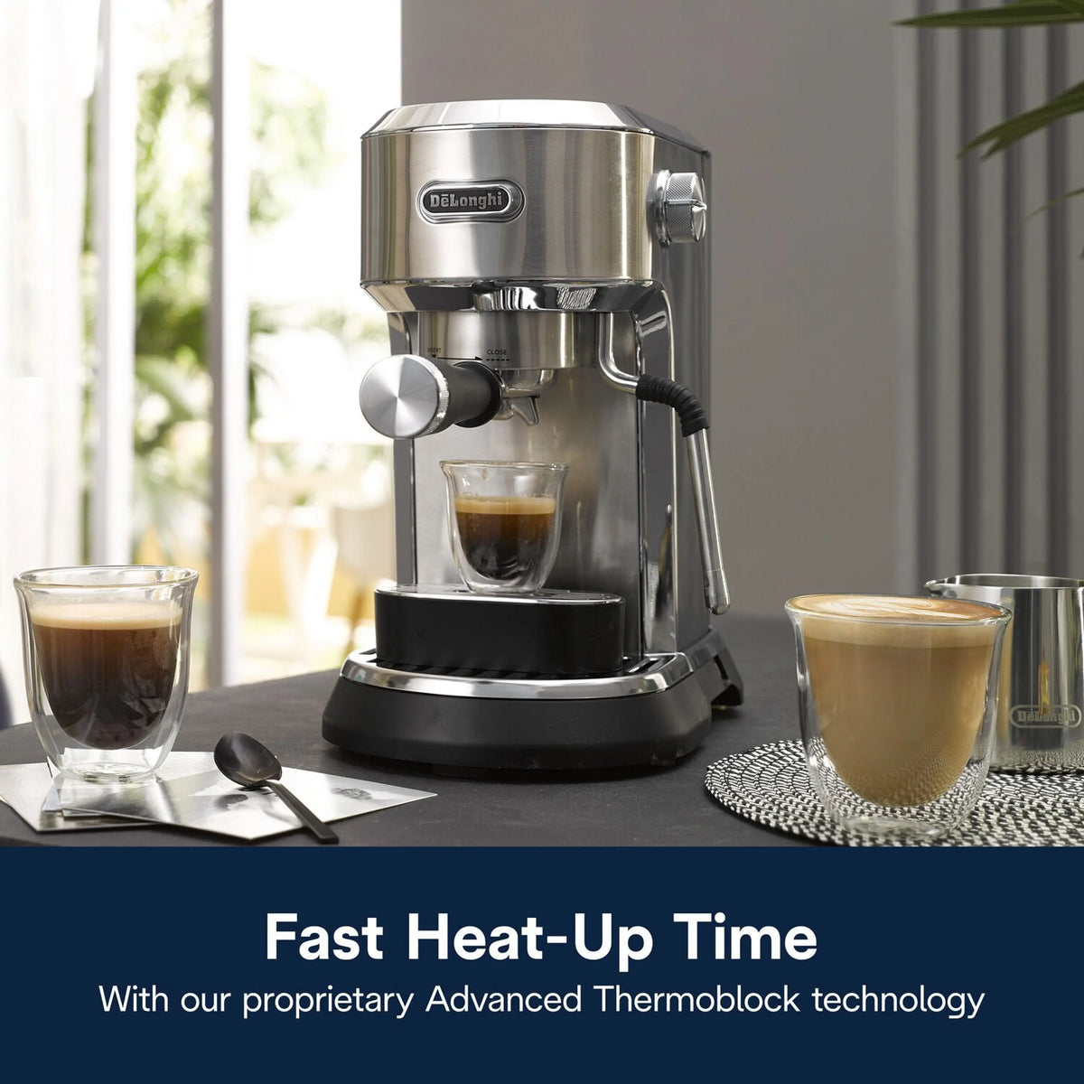 Stainless steel espresso machine on a counter with cups of espresso and latte