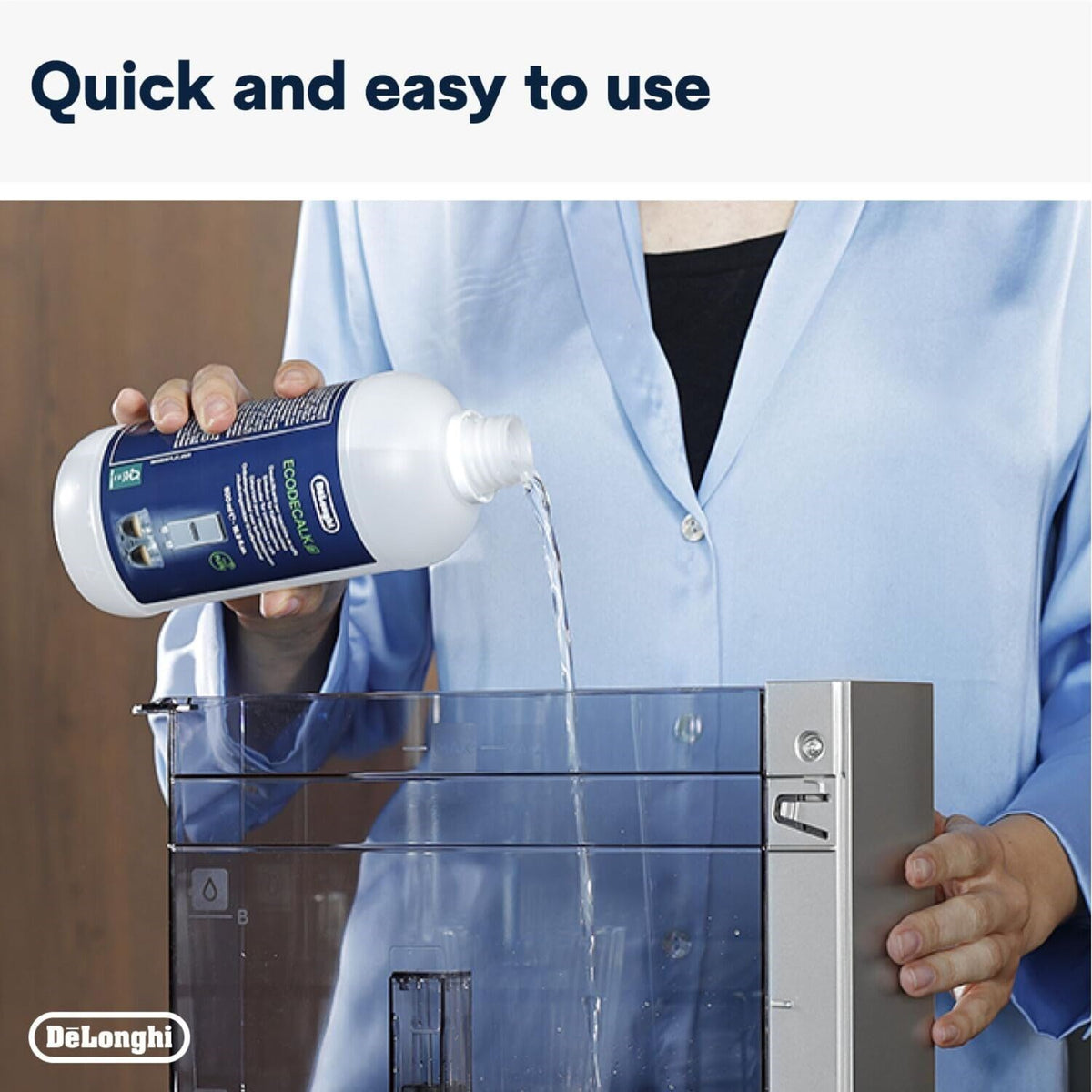 De'Longhi EcoDecalk bottle pouring liquid into a coffee machine water tank.