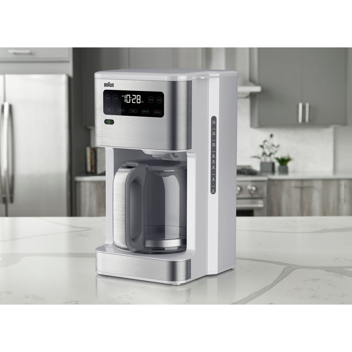 White and stainless steel iced coffee maker on countertop with carafe in place