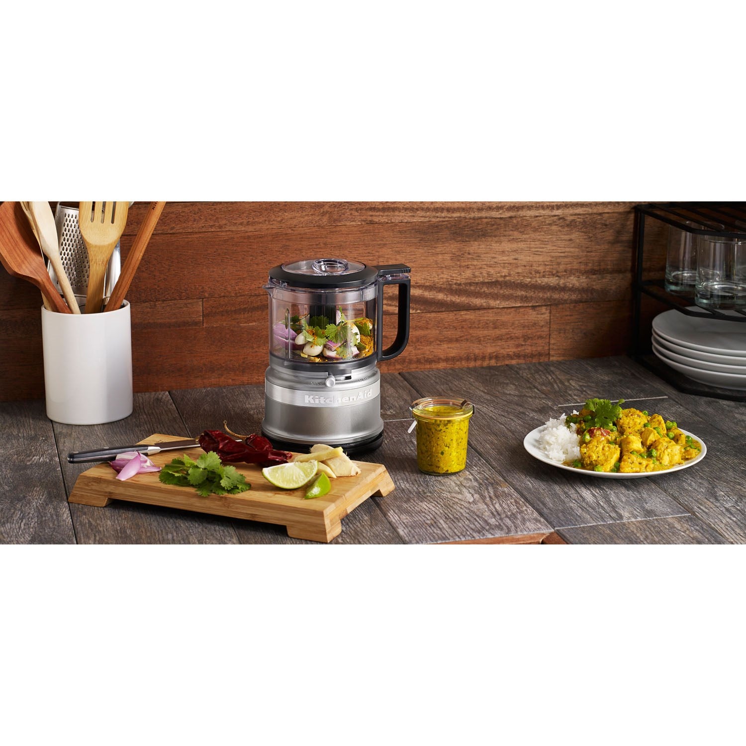 KitchenAid 3.5 cup food chopper on countertop with handle and clear processing bowl