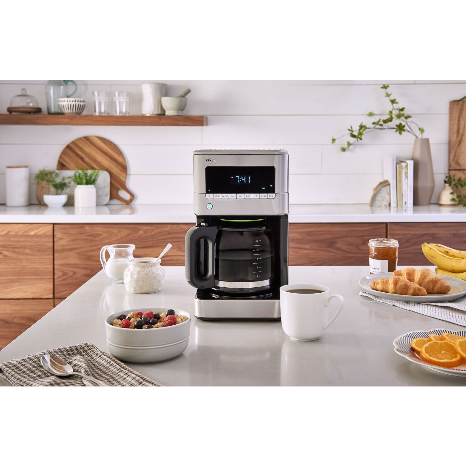 Braun stainless steel drip coffee maker with glass carafe and digital clock display