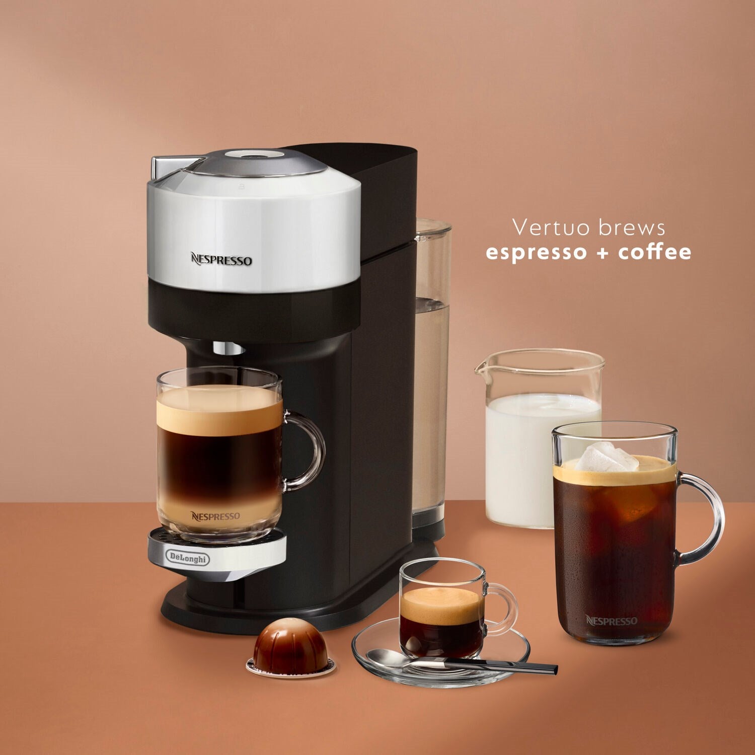Black Nespresso Vertuo Next coffee machine with two mugs and capsule accessories
