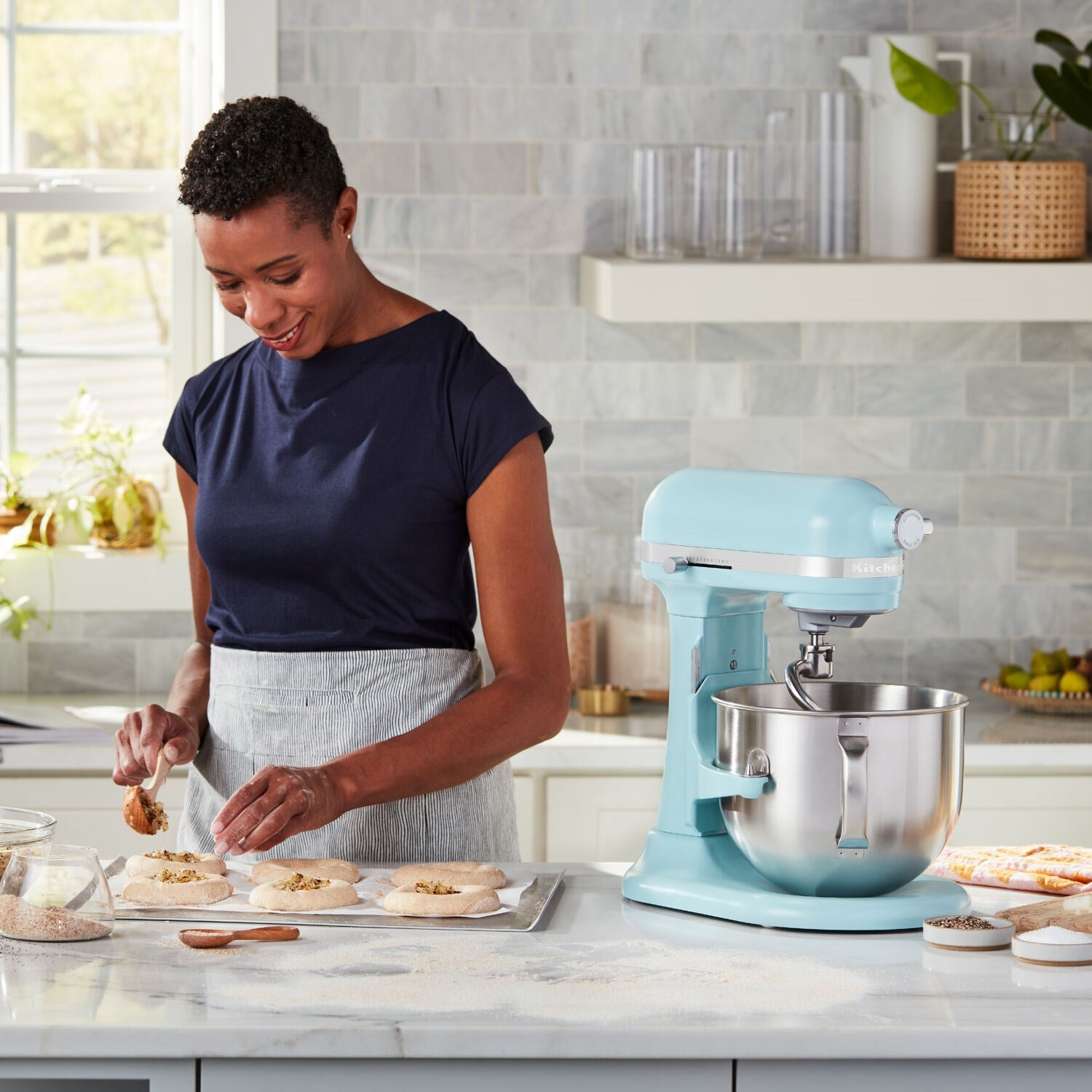 KitchenAid aqua stand mixer with stainless bowl and dough hook