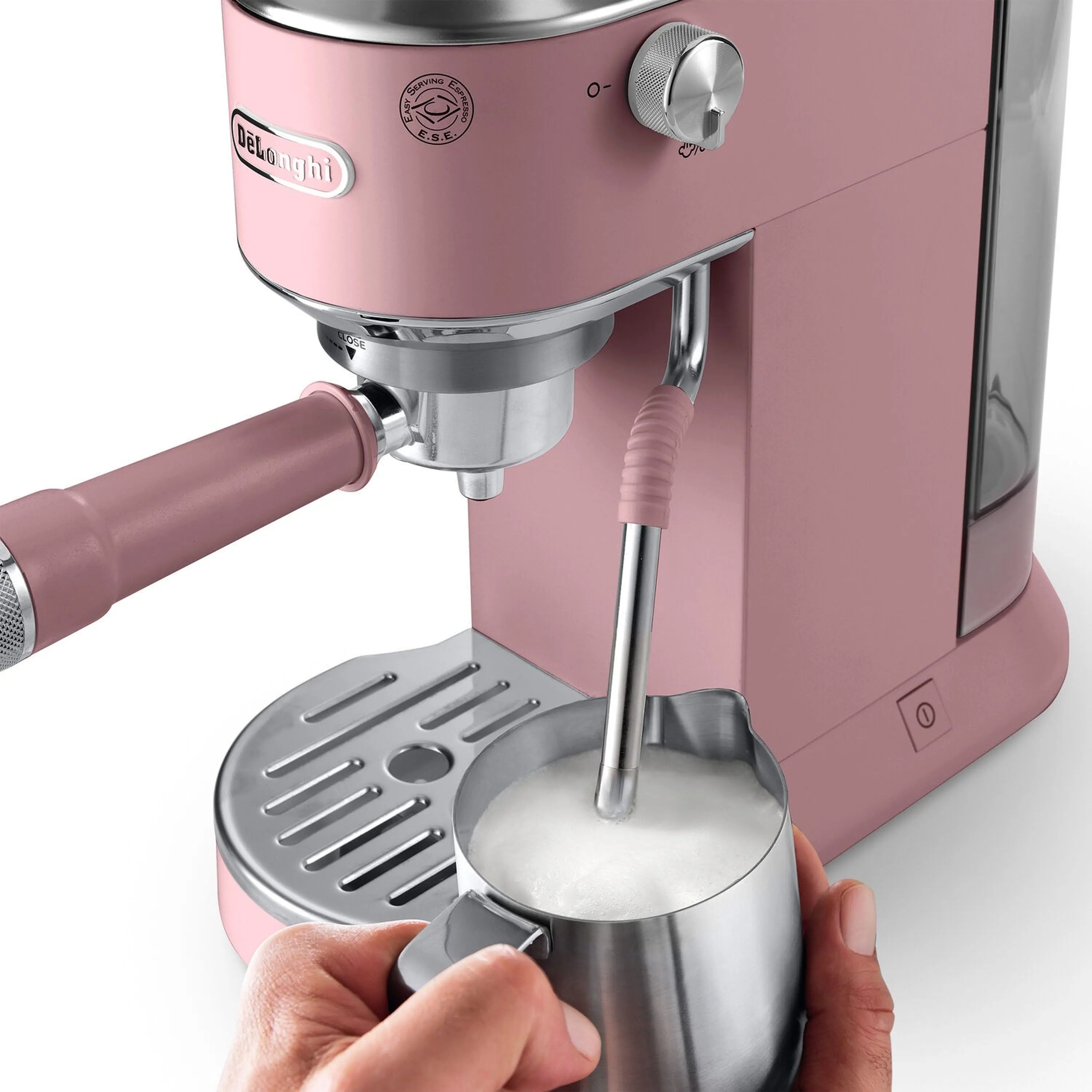 Pink De'Longhi espresso machine close-up with frothing wand and portafilter area