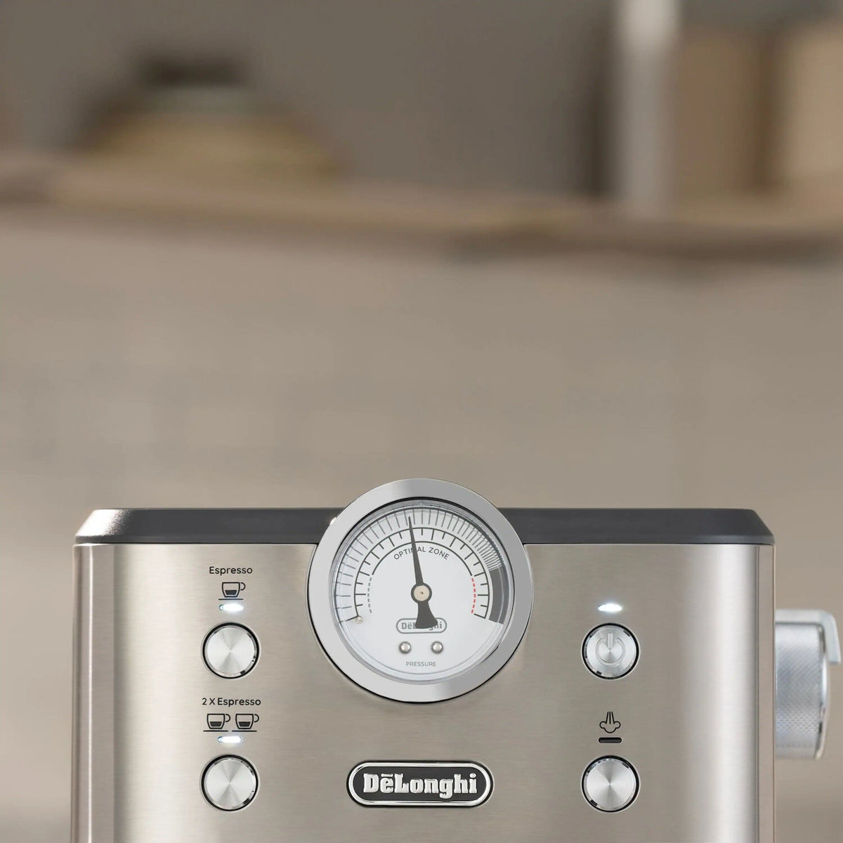 Stainless steel espresso machine top front with round pressure gauge and side control dial