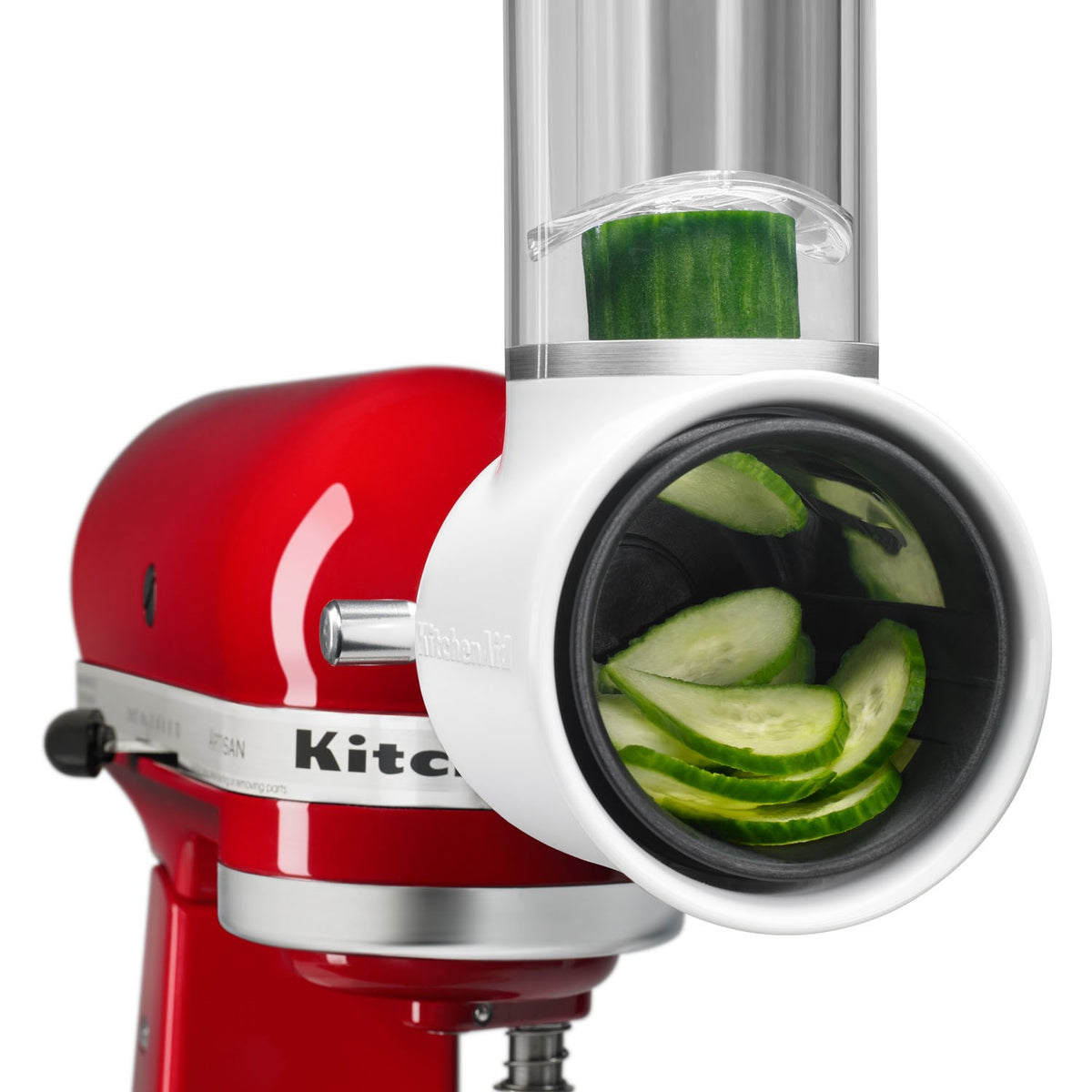 KitchenAid Fresh Prep slicer/shredder attachment feeding green cucumber slices into chute