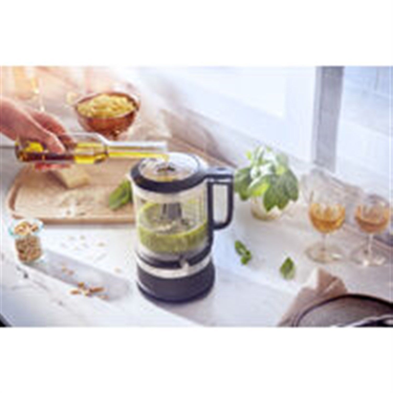 5-cup food chopper with black matte base and clear bowl on countertop