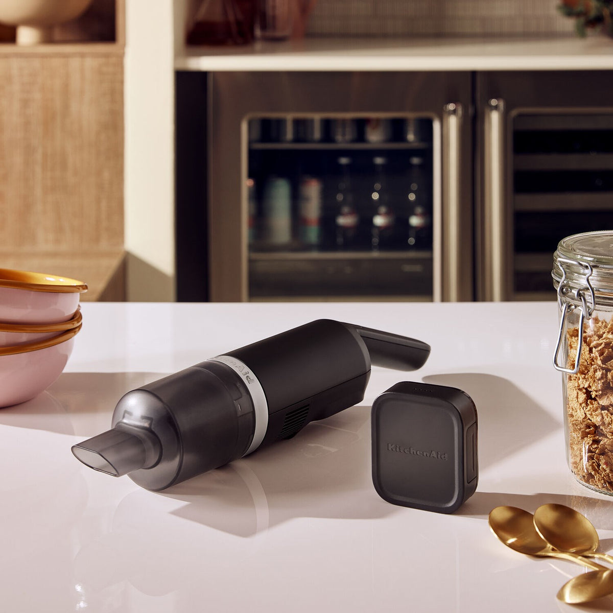 Cordless kitchen vacuum with removable battery base, black matte finish