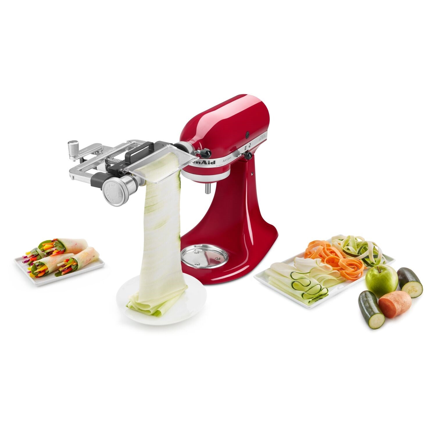 Vegetable sheet cutter attachment on red stand mixer with vegetable ribbons and sheets