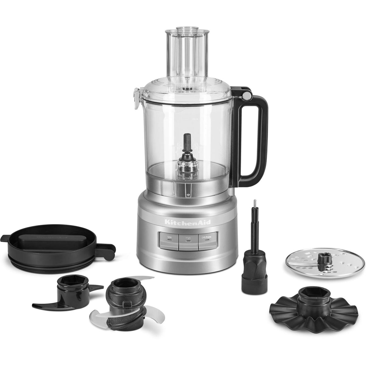 KitchenAid food processor with accessories: black discs, blade, and lid