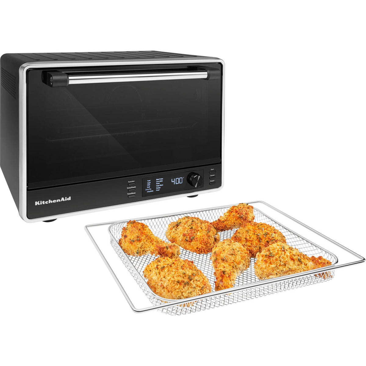 Black countertop oven with a clear window and air-fry tray holding seasoned food