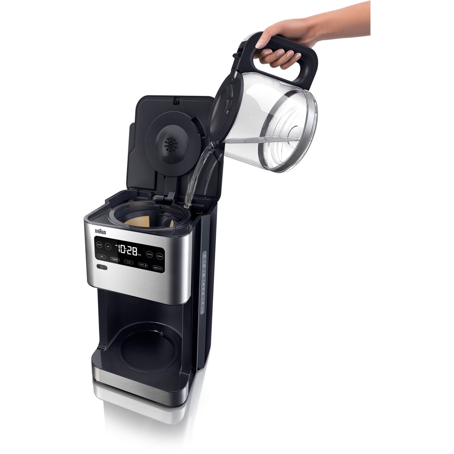 Hand pouring into open top of black iced coffee maker with filter basket