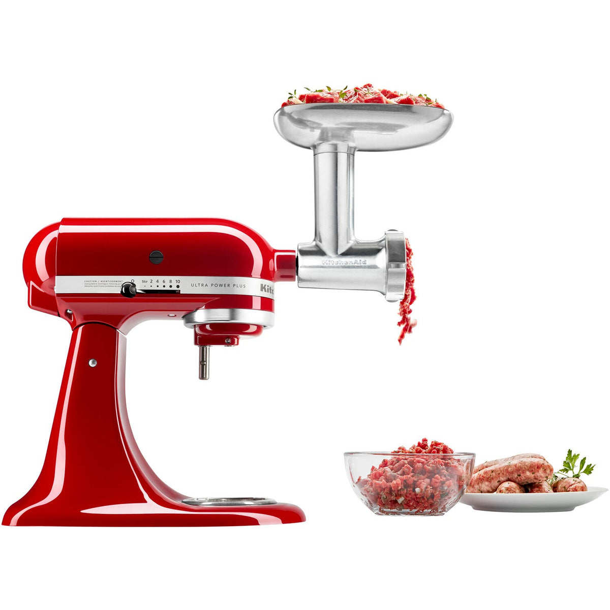 Red KitchenAid stand mixer with metal meat grinder attachment and hopper