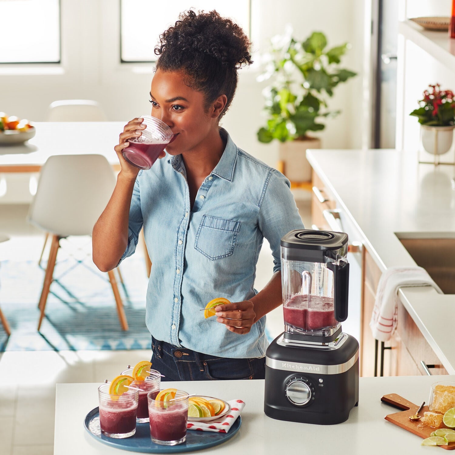 Black KitchenAid blender with clear jar on kitchen counter