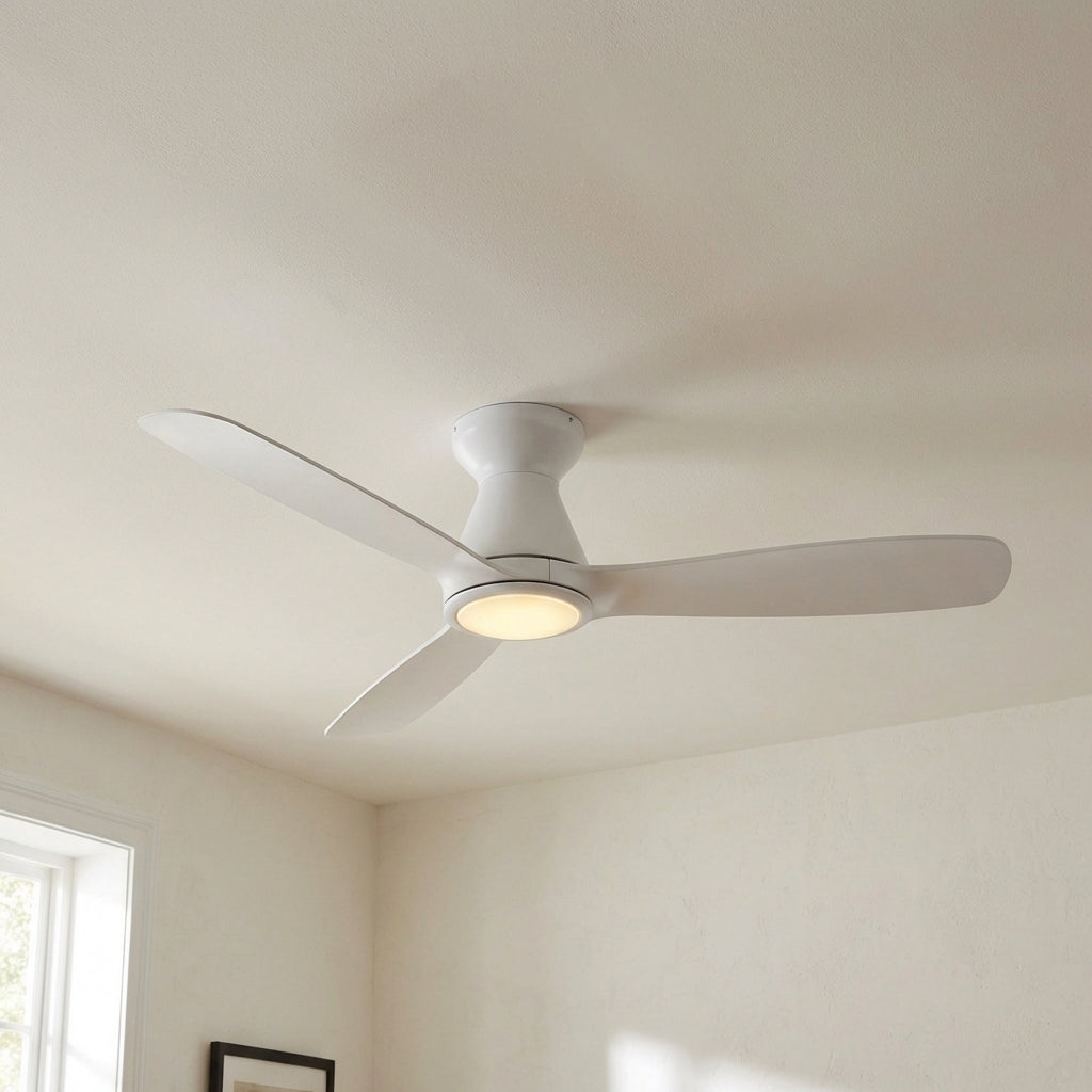 White flush-mount ceiling fan with LED light and three wide blades.