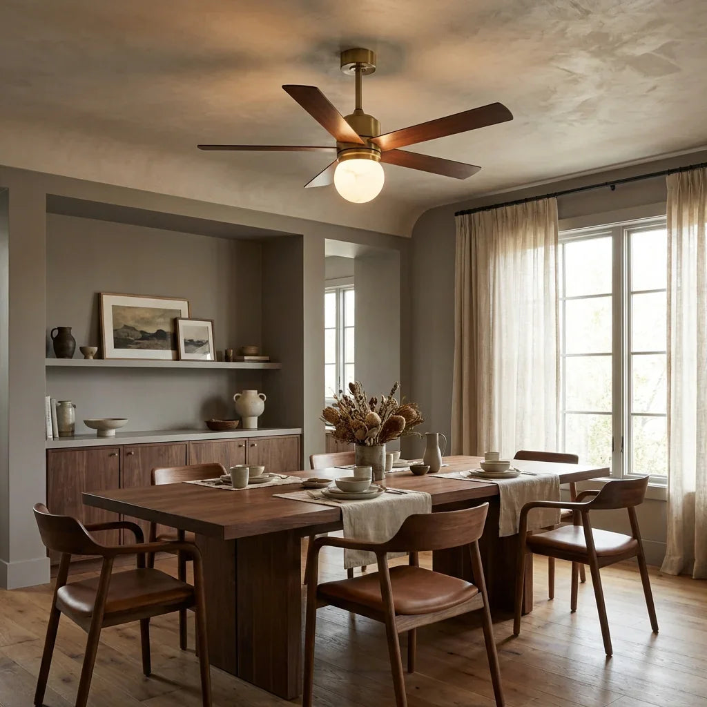 LED ceiling fan with walnut blades and golden motor housing, lit frosted globe