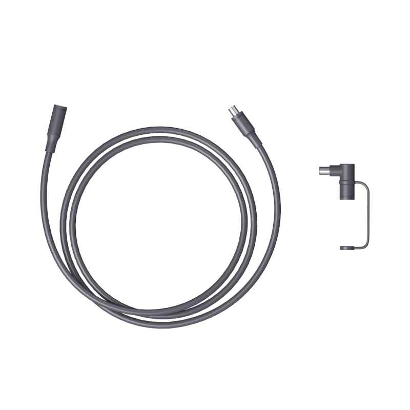 Coiled black DC extension cable with two plug ends and small L-style adapter