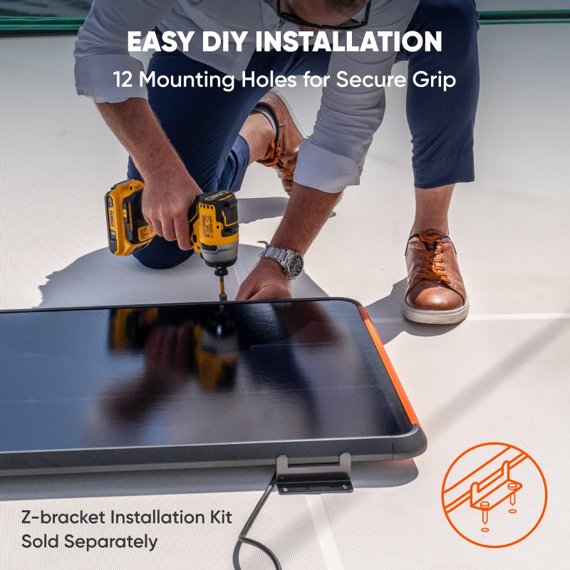 Portable solar panel being drilled for mounting; foldable panel with orange edge trim