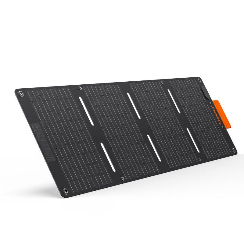 Foldable black portable solar panel with orange tabs and metal grommet corners