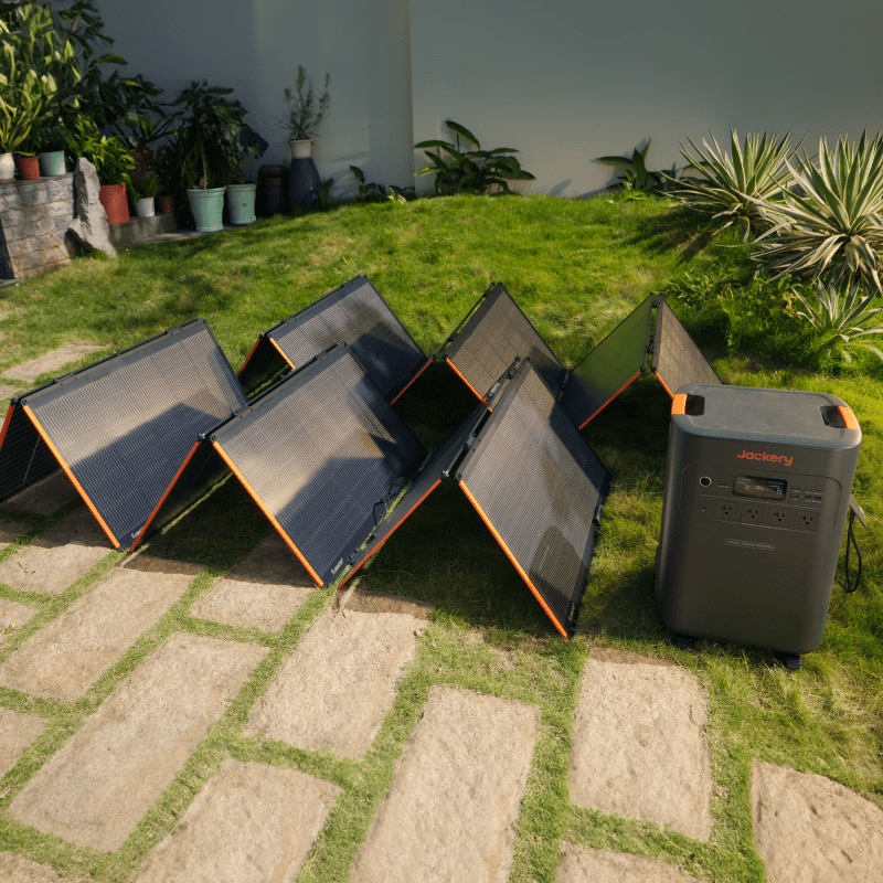 Foldable bifacial solar panels in open position, black cells and orange trim