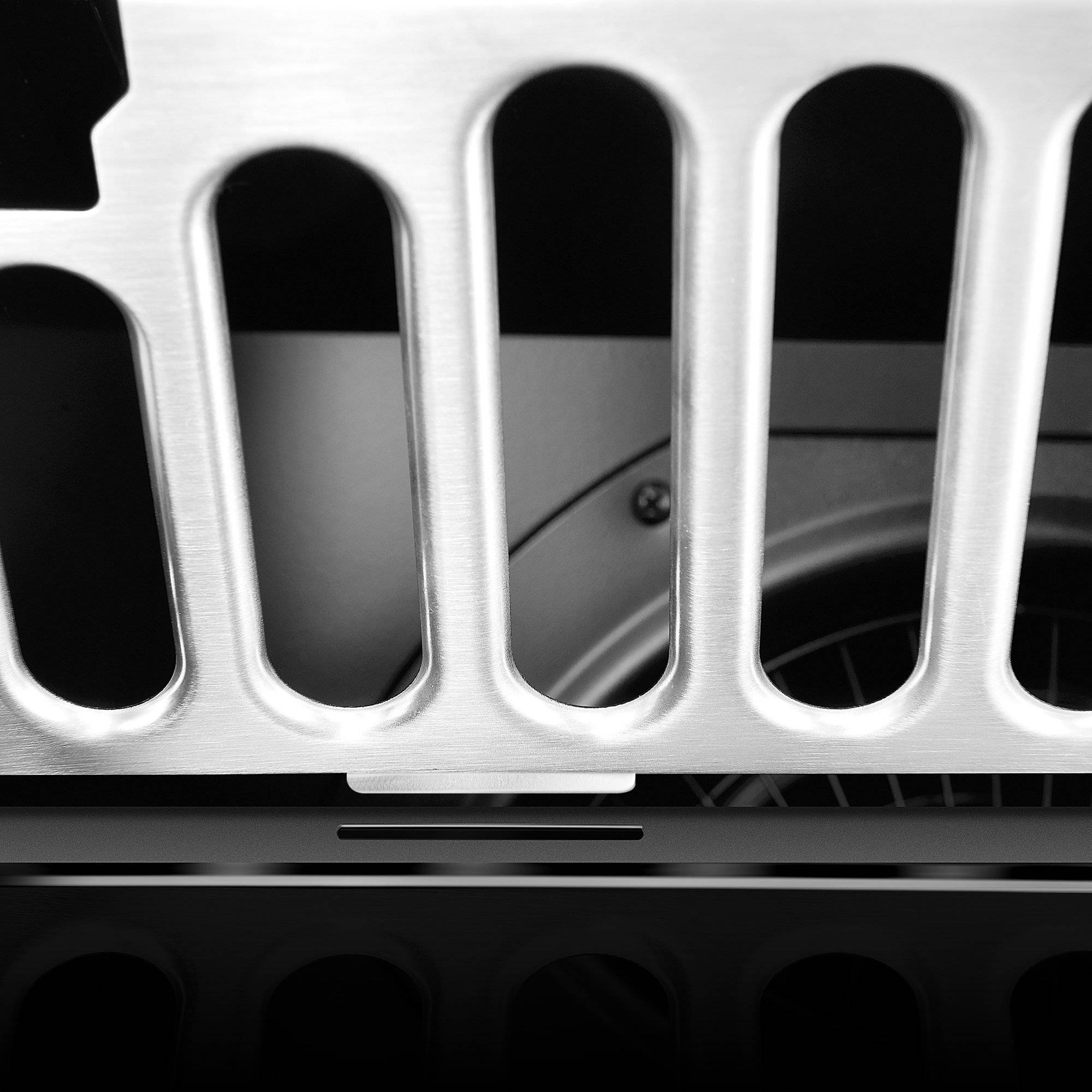 Close-up of stainless vent baffle with rounded perforation openings